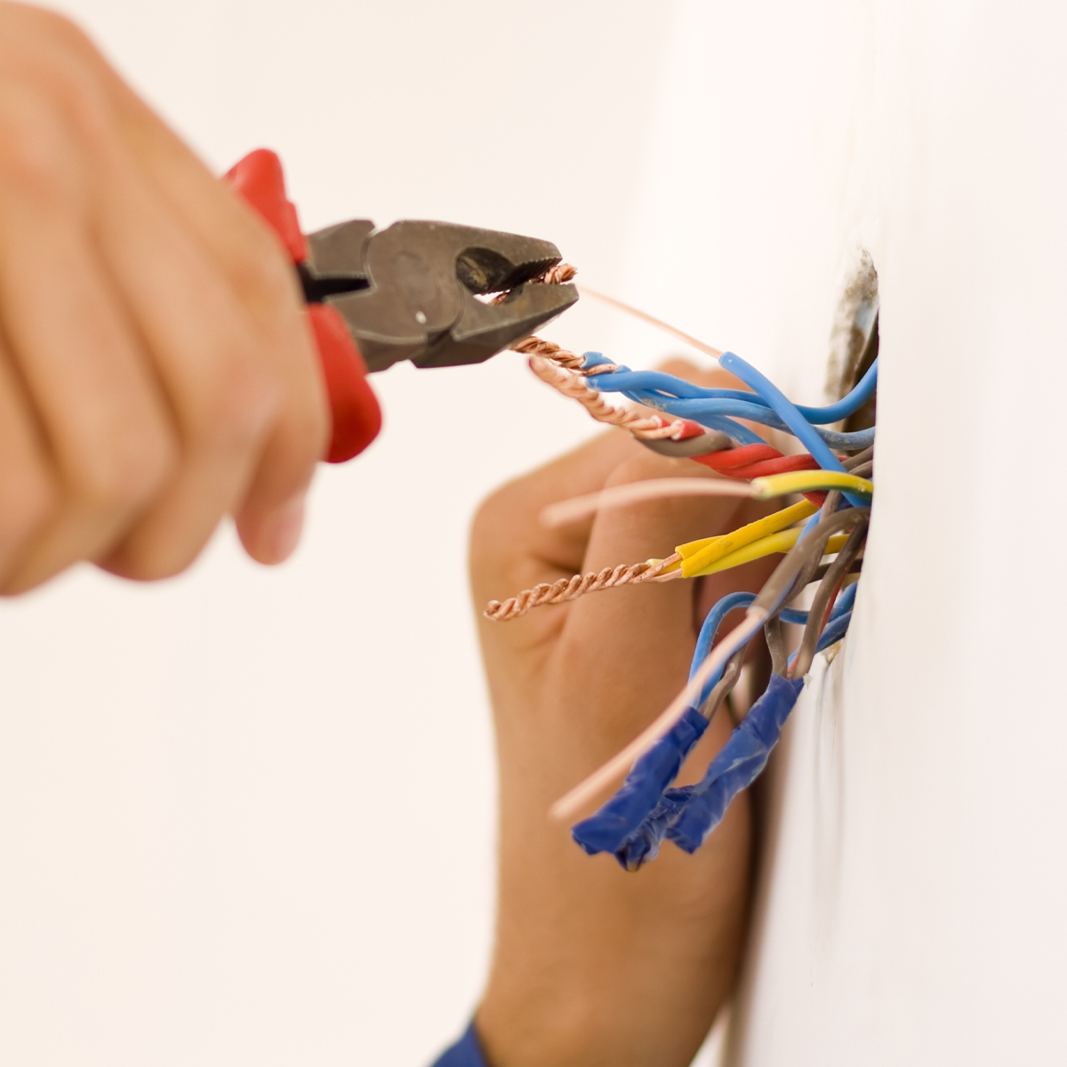 Electrical contractors discuss plans in a new construction home.