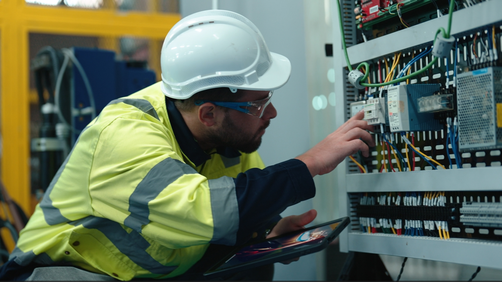 Electrical contractors discuss plans in a new construction home.